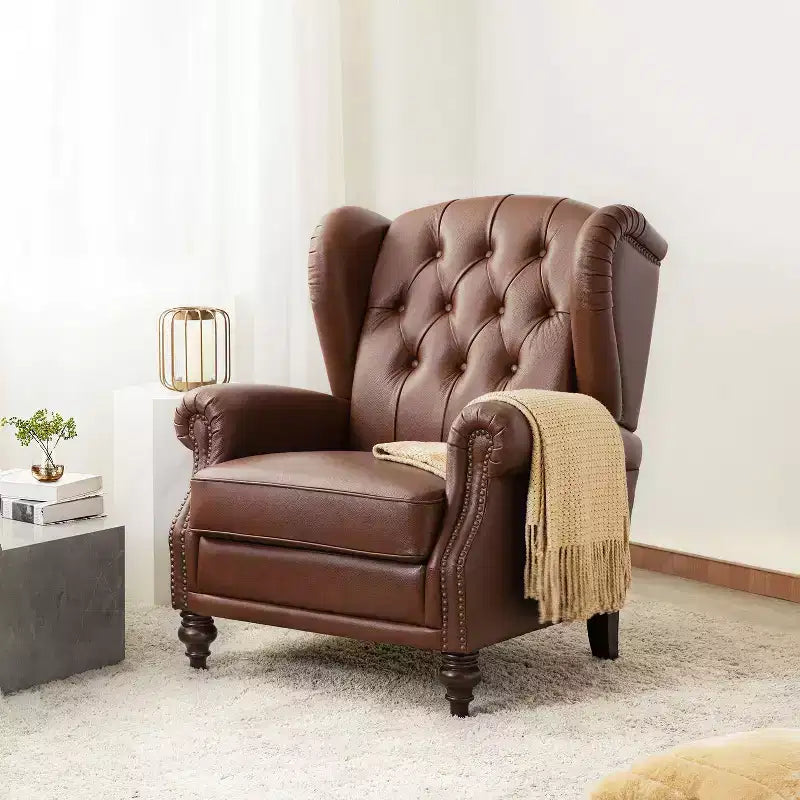 Fauteuil cabriolet en cuir véritable de 84 cm de large avec pieds fuselés en bois et garniture cloutée