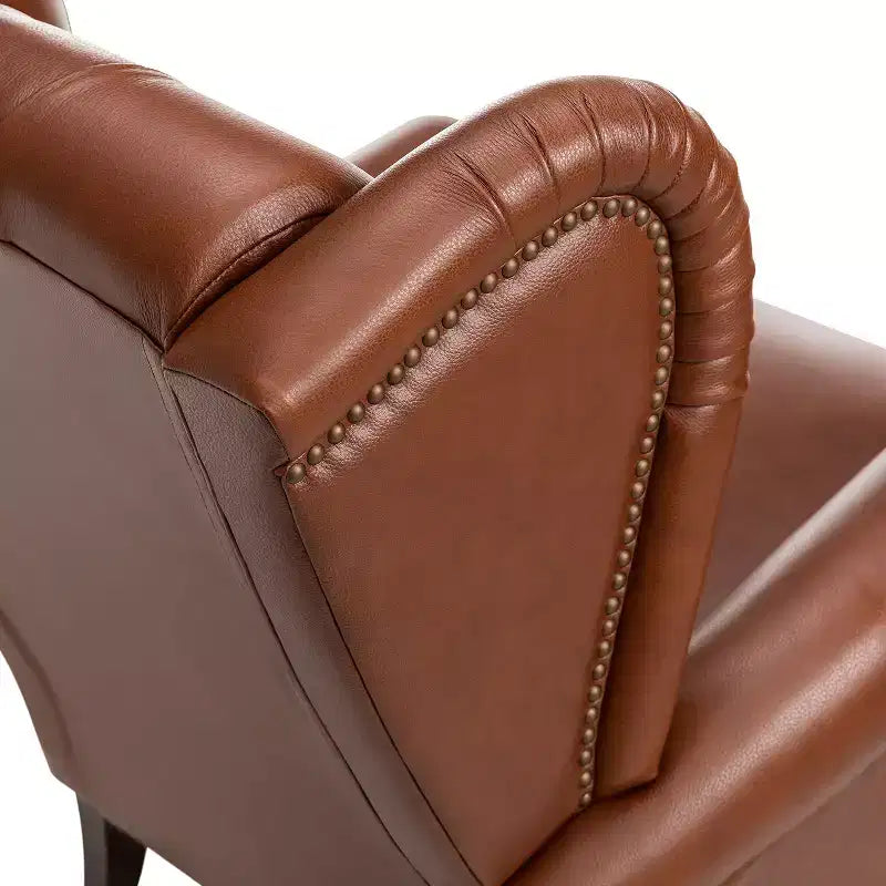 Fauteuil cabriolet en cuir véritable de 84 cm de large avec pieds fuselés en bois et garniture cloutée