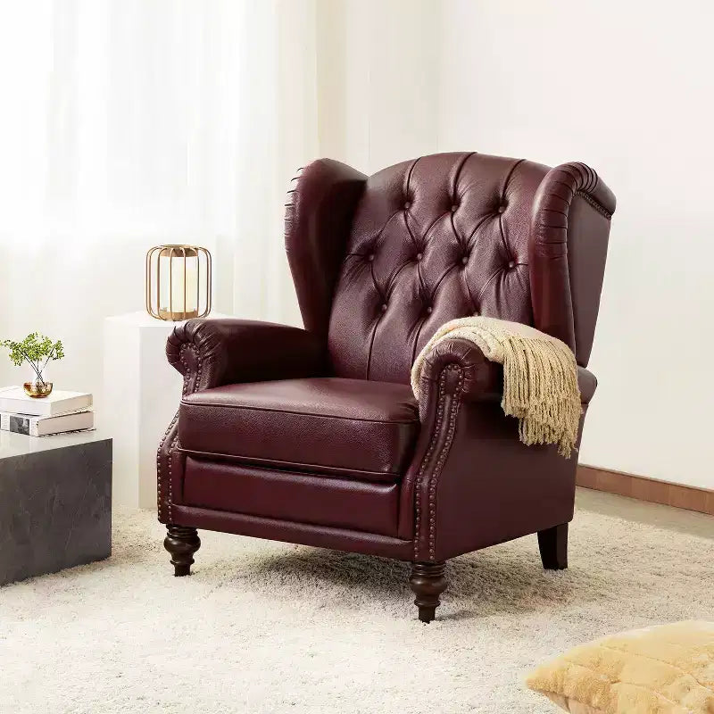 Fauteuil cabriolet en cuir véritable de 84 cm de large avec pieds fuselés en bois et garniture cloutée