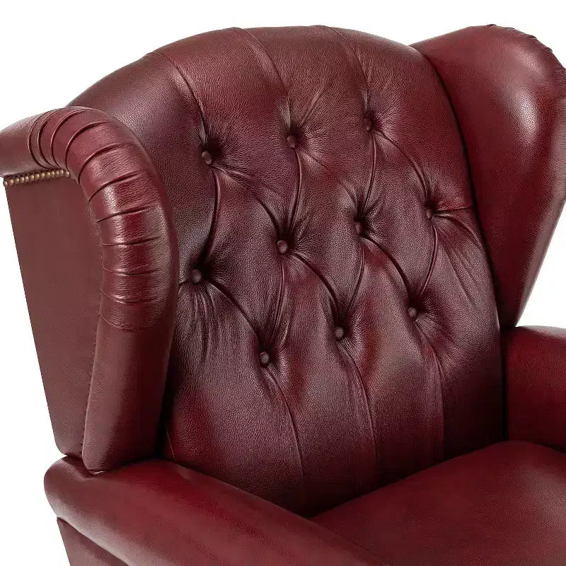 Fauteuil cabriolet en cuir véritable de 84 cm de large avec pieds fuselés en bois et garniture cloutée
