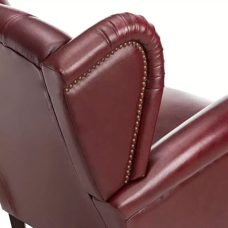 Fauteuil cabriolet en cuir véritable de 84 cm de large avec pieds fuselés en bois et garniture cloutée