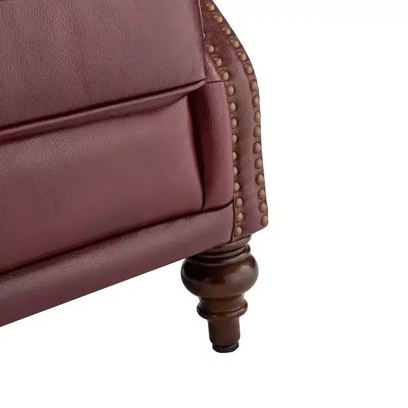 Fauteuil cabriolet en cuir véritable de 84 cm de large avec pieds fuselés en bois et garniture cloutée