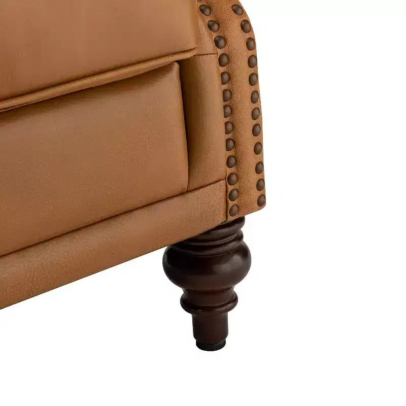Fauteuil cabriolet en cuir véritable de 84 cm de large avec pieds fuselés en bois et garniture cloutée
