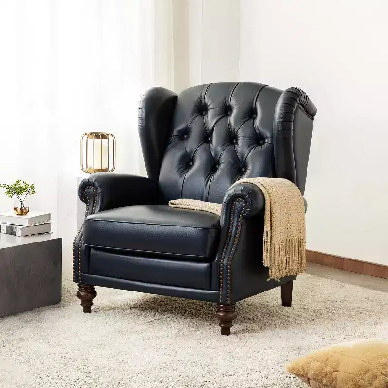 Fauteuil cabriolet en cuir véritable de 84 cm de large avec pieds fuselés en bois et garniture cloutée